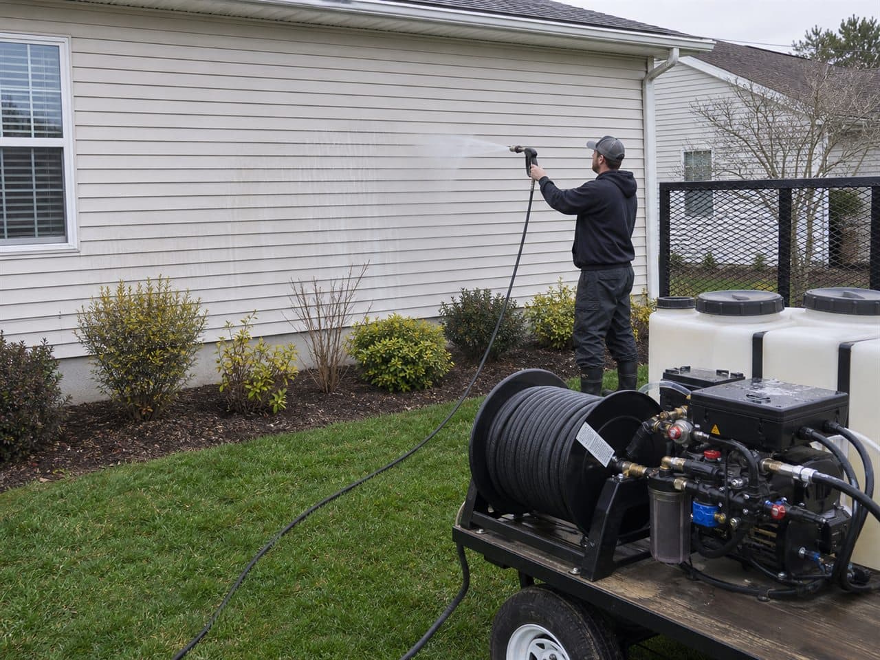 Soft washing a vinyl-sided home in Erie County, PA